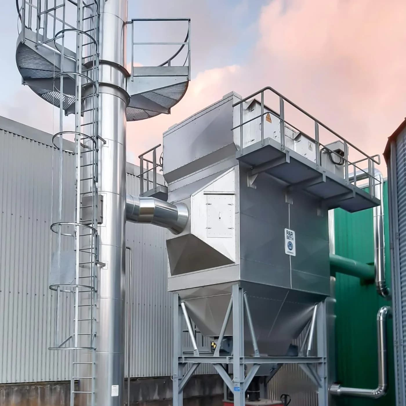Dry electrostatic precipitator with access stair tower and platforms at dusk